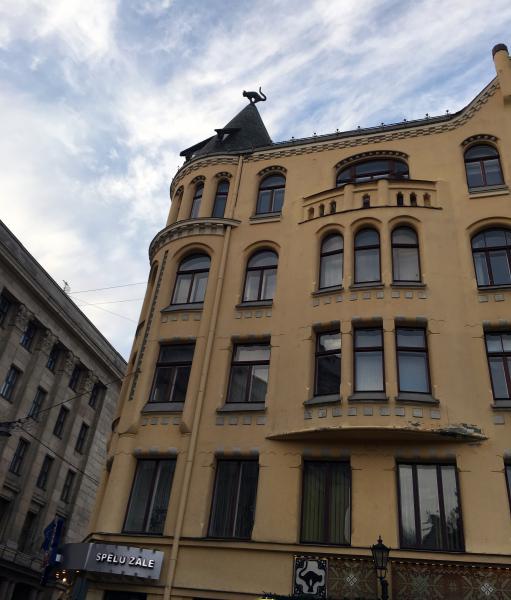 Cat House in Riga - cat sculpture on the roof
