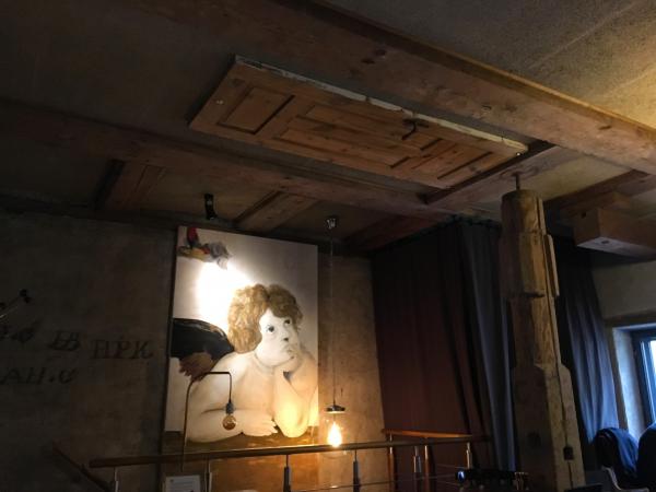 Door on the ceiling in a cafe in Riga